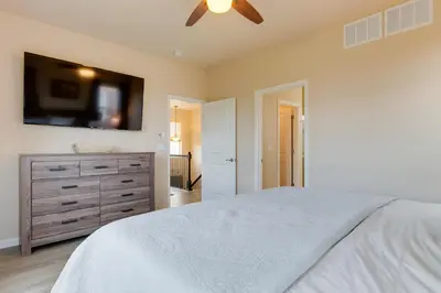 a bedroom with a bed and a flat screen tv at Westminster Home with Patio and BBQ Near Dtwn Denver in Westminster