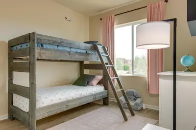 a bunk bed with a ladder in a room at Westminster Home with Patio and BBQ Near Dtwn Denver in Westminster