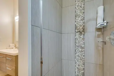 a shower with a glass door in a bathroom at Ski Retreat Keystone Resort Condo with Heated Pool! in Keystone