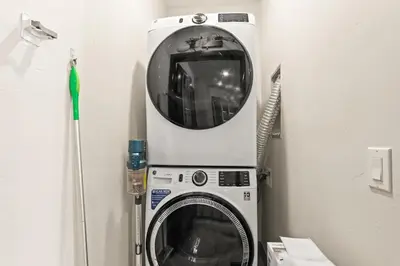 a washing machine with a mirror on top of it at The Snake River Chalet in Keystone