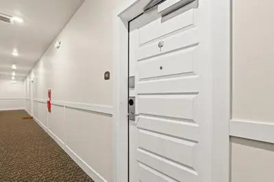 a white garage door in a hallway at The Snake River Chalet in Keystone