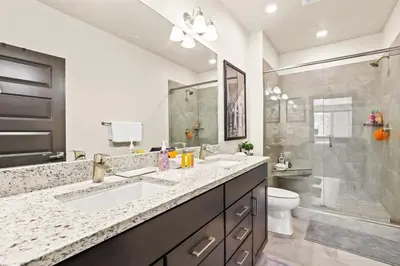 a bathroom with two sinks and a shower at The Snake River Chalet in Keystone