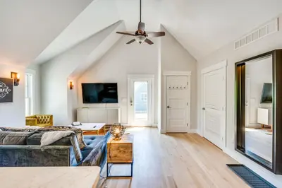 a living room with a couch and a ceiling fan at 14 Mi to Dtwn Denver Sleek Westminster Home in Westminster