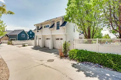 a white house with a white fence at 14 Mi to Dtwn Denver Sleek Westminster Home in Westminster