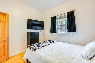 a bedroom with a bed and a window at 2 Mi to Lake Estes Home with Deck and Grill in Estes Park