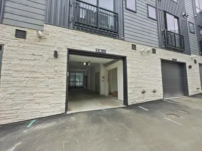 a building with a garage with a door open at 58B 2Br 2,5Ba townhouse in Silverthorne