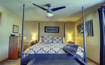 a bedroom with a bed with a ceiling fan at E8 Drake Landing 2Br Loft condo in Frisco