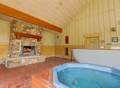 a large room with a hot tub and a fireplace at E8 Drake Landing 2Br Loft condo in Frisco