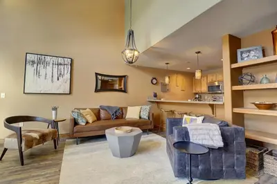 a living room with a couch and a table at E8 Drake Landing 2Br Loft condo in Frisco