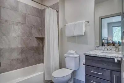 a bathroom with a toilet and a shower and a sink at Clearwater Lofts - 3 Bedroom Luxury Condo Near Lakeside Village in Keystone