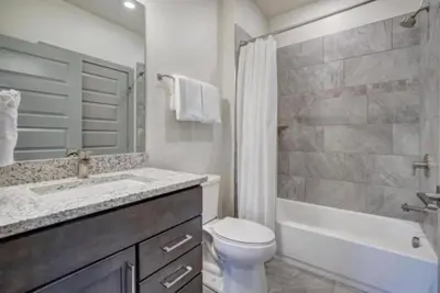 a bathroom with a sink and a toilet and a bath tub at Clearwater Lofts - 3 Bedroom Luxury Condo Near Lakeside Village in Keystone