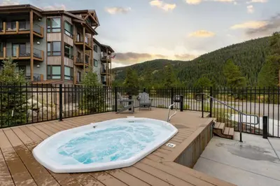 a bath tub sitting on top of a deck at Clearwater Lofts - 3 Bedroom Luxury Condo Near Lakeside Village in Keystone