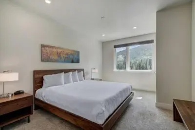 a bedroom with a large bed and a window at Clearwater Lofts Luxury 1 Bed Condo Near Lakeside Village in Keystone
