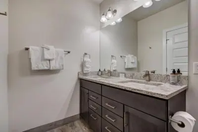 a bathroom with a sink and a large mirror at Clearwater Lofts Luxury 1 Bed Condo Near Lakeside Village in Keystone