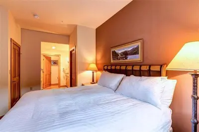 a bedroom with a large white bed in a room at River Run Village Condos - 2 Bedroom - Walk To Lift! in Keystone