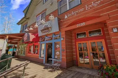 a dunkin donuts store on a wooden deck at River Run Village Condos - 2 Bedroom - Walk To Lift! in Keystone