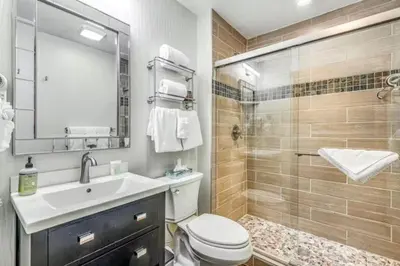 a bathroom with a toilet and a sink and a shower at River Run Village 2 Bedroom At Red Hawk in Dillon