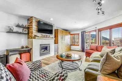 a living room with a couch and a table at River Run Village 2 Bedroom At Red Hawk in Dillon