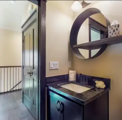 a bathroom with a sink and a mirror at River Run Townhomes - 3 Bedroom - Walk To Slopes! in Keystone