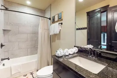 a bathroom with a sink and a tub and a toilet at River Run Townhomes - 3 Bedroom - Walk To Slopes! in Keystone