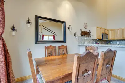 a dining room with a table and chairs and a mirror at Fraser Vacation Rental 6 Mi to Ski Resort in Fraser