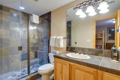a bathroom with a toilet and a sink and a shower at Fraser Vacation Rental 6 Mi to Ski Resort in Fraser