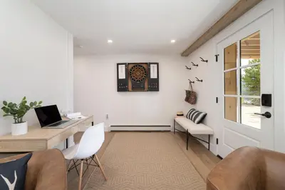 a home office with a desk and a laptop at Ski Shores cabin in Grand Lake