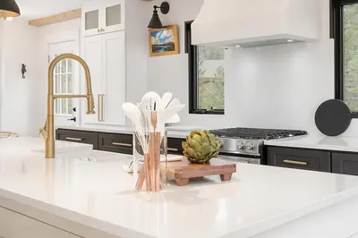a kitchen with a white counter top and a sink at Ski Shores cabin in Grand Lake