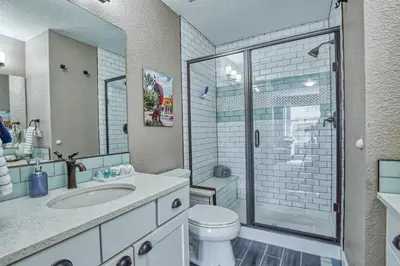 a bathroom with a toilet and a sink and a shower at 2 Bedroom townhome, super close to downtown FC! in Fort Collins