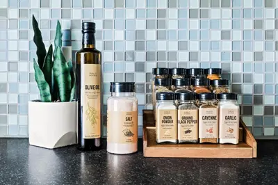 a group of bottles of wine sitting on a counter at Contemporary Finishes - Studio Apt - Sloans Lake in Denver
