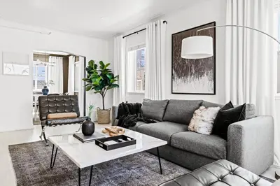 a living room with a couch and a table at New Stylish Sanctuary - King Beds - Sloans Lake in Denver