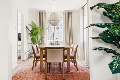 a dining room with a wooden table and chairs at Modern Comfort - King Beds - Walk to Sloans Lake in Denver