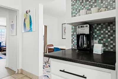 a kitchen with a coffee maker on a counter at Bright & Modern Retreat - King Beds - Sloans Lake in Denver