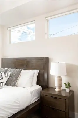a bedroom with a bed and a window at Center of LoHi - Roof Deck - Walk Everywhere in Denver