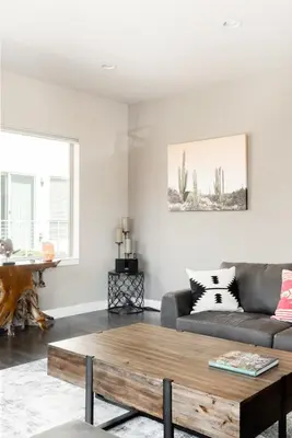 a living room with a couch and a coffee table at Center of LoHi - Roof Deck - Walk Everywhere in Denver