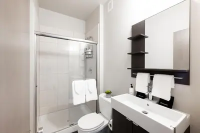 a bathroom with a sink and a toilet and a shower at Center of LoHi - Roof Deck - Walk Everywhere in Denver