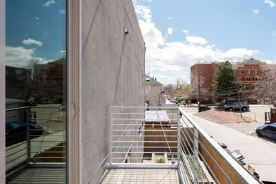 a balcony with a view of a city street at Center of LoHi - Roof Deck - Walk Everywhere in Denver