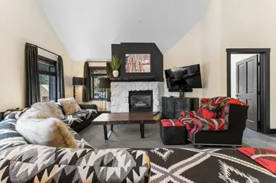 a living room with a couch and a fireplace at Arap Ldg 8130 in Keystone