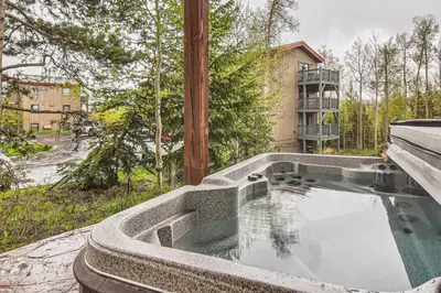 a swimming pool on the side of a house at 42 Burgundy 4Br 3,5Ba townhouse in Silverthorne