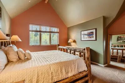 a bedroom with a bed and a window at 42 Burgundy 4Br 3,5Ba townhouse in Silverthorne