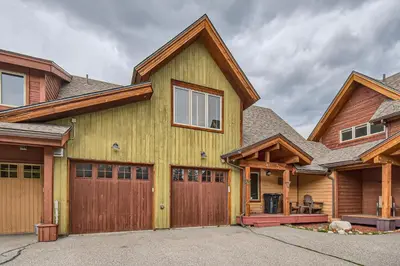 a wooden house with a garage at 42 Burgundy 4Br 3,5Ba townhouse in Silverthorne