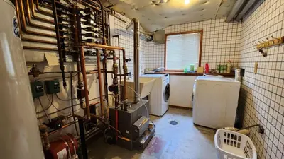 a room with a kitchen with a bunch of appliances at 5BR Mountain Retreat with Hot Tub and Sauna in Silverthorne