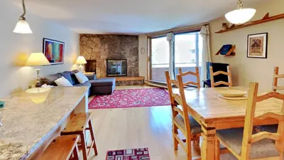 a kitchen and living room with a table and a dining room at 135 Marina Place in Dillon