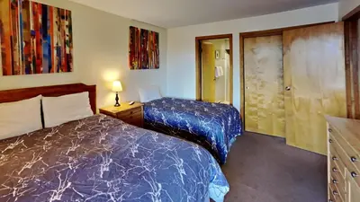 a hotel room with two beds and a closet at 135 Marina Place in Dillon