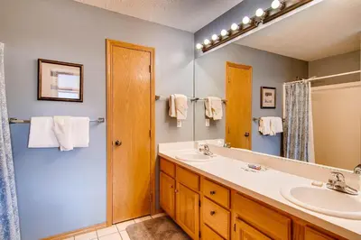 a bathroom with a sink and a mirror at 2028 Ryan Gulch in Silverthorne