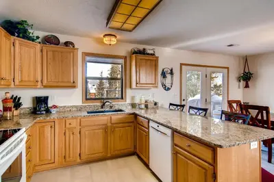 a kitchen with wooden cabinets and a counter top at 2028 Ryan Gulch in Silverthorne