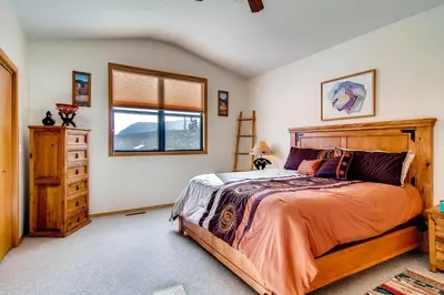 a bedroom with a bed and a window and a dresser at 2028 Ryan Gulch in Silverthorne