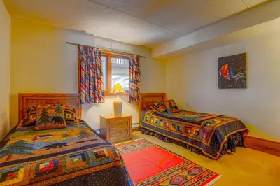 a bedroom with two beds and a window at 207 Point Dillon in Dillon