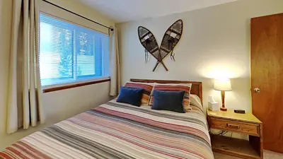 a bedroom with a bed and a window at 205-F Buffalo Ridge in Silverthorne