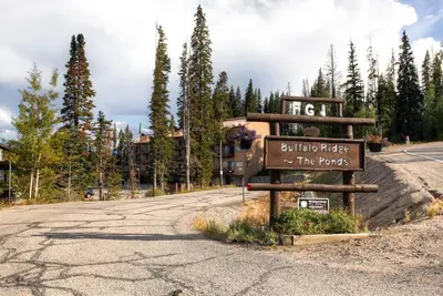 a sign on the side of a road in front of a building at 205-F Buffalo Ridge in Silverthorne